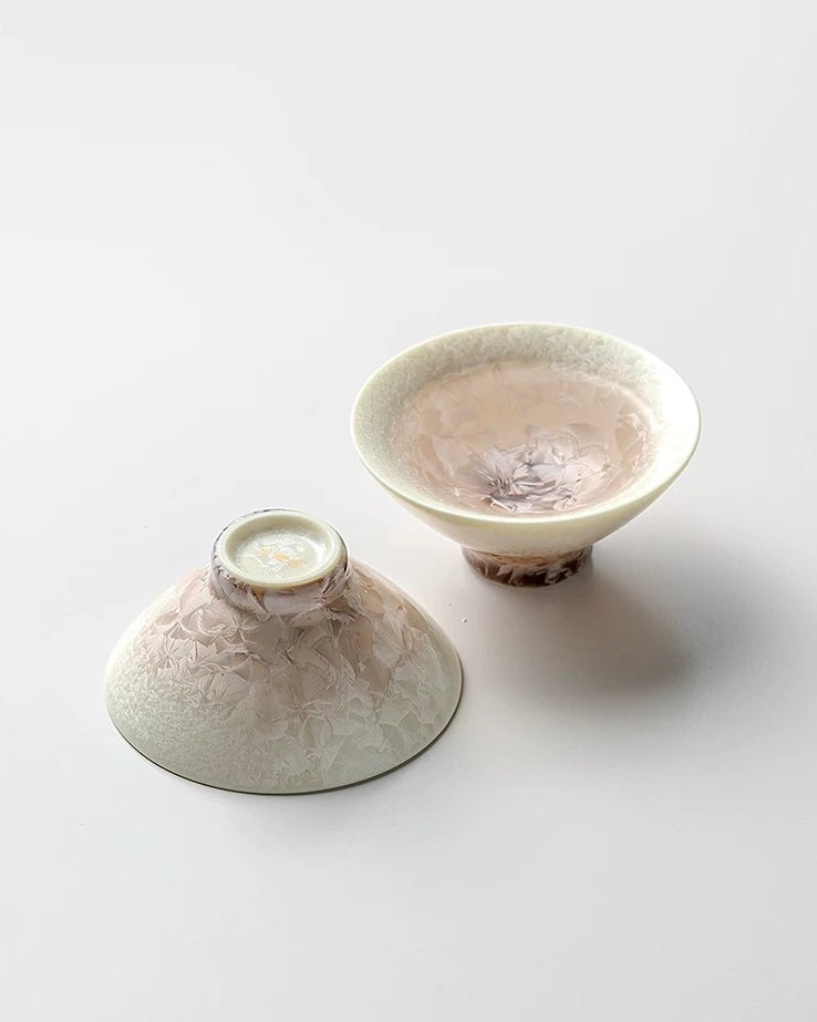 Untable two ceramic bowls with textured surfaces on a white background