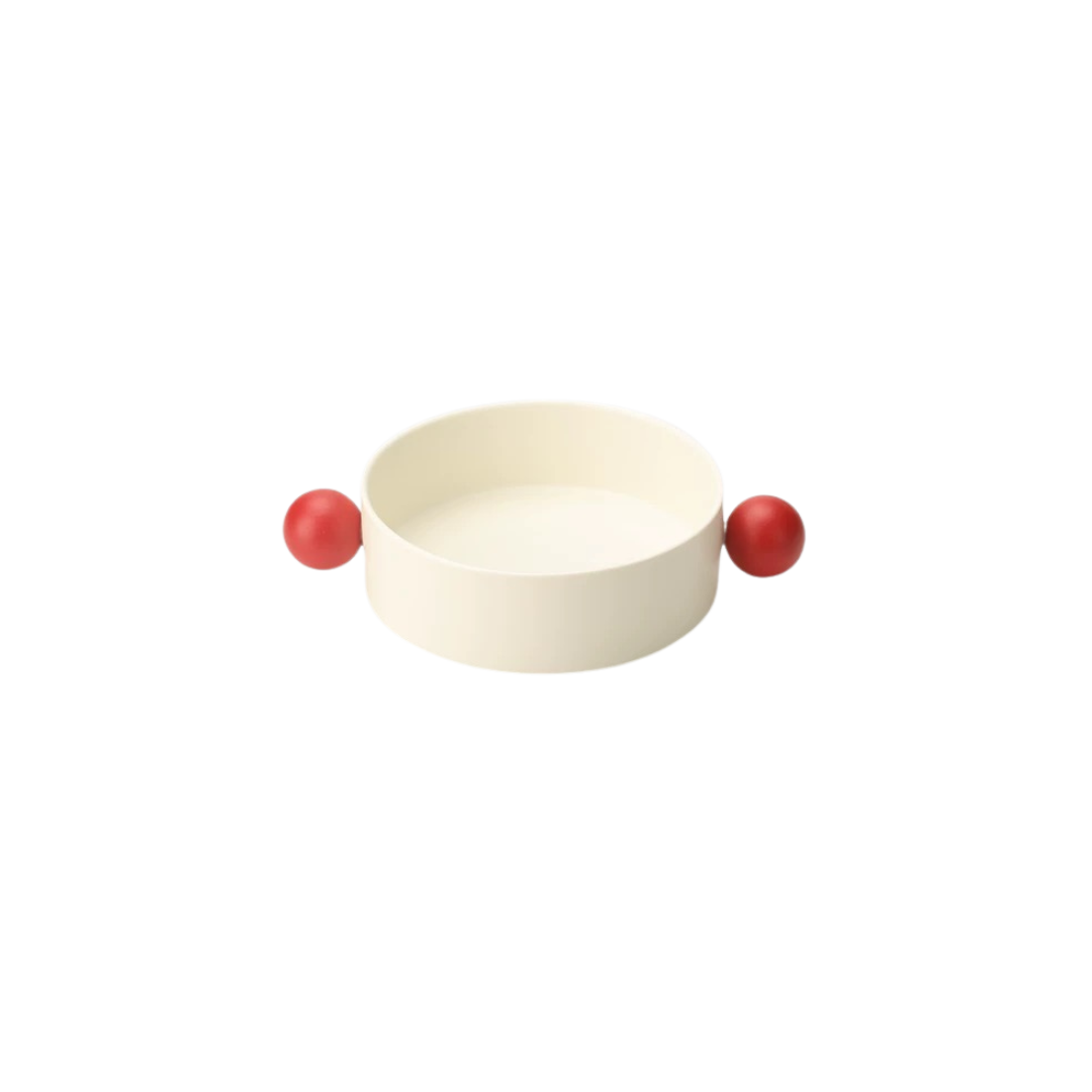 A white ceramic decorative bowl with red accents designed for serving snacks or as a decorative piece from Untable