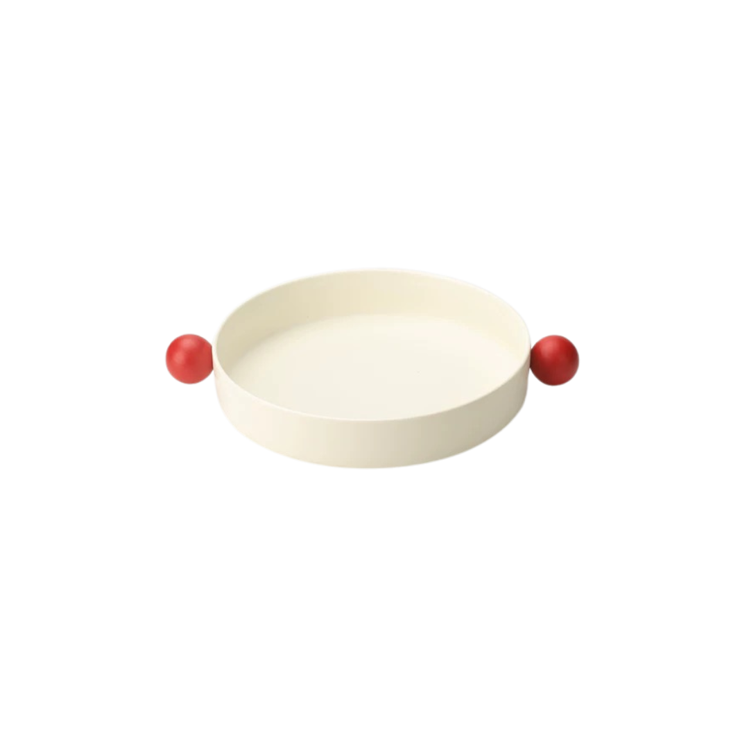 A white ceramic decorative bowl with red accents designed for serving snacks or as a decorative piece from Untable